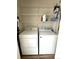 Convenient laundry area with shelving and appliances at 7883 S Kalispell Cir, Englewood, CO 80112