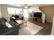 Comfortable living room with ceiling fan and modern decor at 7883 S Kalispell Cir, Englewood, CO 80112