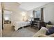 Bright bedroom with a desk and workspace area, and neutral color carpeting at 21125 E 43Rd Ave, Denver, CO 80249