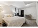 Cozy bedroom featuring a large bed, desk setup, and comfortable seating area at 21125 E 43Rd Ave, Denver, CO 80249
