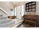 Inviting entryway with tiled floor, staircase, piano, and natural light at 21125 E 43Rd Ave, Denver, CO 80249