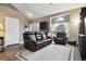 Bright living room features vaulted ceiling, large window and comfortable seating at 21125 E 43Rd Ave, Denver, CO 80249