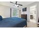 Bright bedroom with large windows and an ensuite bathroom at 21125 E 43Rd Ave, Denver, CO 80249