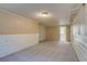 Finished basement with carpet, wainscoting, and light at 3685 Jasmine St, Denver, CO 80207