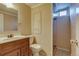 Bathroom features updated vanity, toilet, and shower stall at 3685 Jasmine St, Denver, CO 80207
