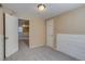 Bedroom with neutral carpet, white door, and classic wainscoting at 3685 Jasmine St, Denver, CO 80207
