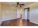 This bedroom features hardwood floors, a closet, and a ceiling fan at 3685 Jasmine St, Denver, CO 80207