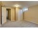 Bedroom with a window, closet, and neutral carpet at 3685 Jasmine St, Denver, CO 80207