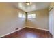 Bedroom with two windows and wood floor at 3685 Jasmine St, Denver, CO 80207