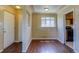 Hardwood floors and a bright window in dining room showcases open floor plan at 3685 Jasmine St, Denver, CO 80207