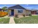 Charming home featuring a well-kept lawn and a classic brick facade at 3685 Jasmine St, Denver, CO 80207