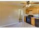 This kitchen features black appliances, a window, tile floors, and wood cabinets at 3685 Jasmine St, Denver, CO 80207