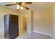 This kitchen features black appliances, a window, tile floors, and wood cabinets at 3685 Jasmine St, Denver, CO 80207