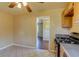 This kitchen features black appliances, a window, tile floors, and wood cabinets at 3685 Jasmine St, Denver, CO 80207