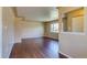 Inviting living room featuring gleaming hardwood floors and neutral paint at 3685 Jasmine St, Denver, CO 80207