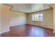 Bright living room with hardwood floors and large window showcasing natural light at 3685 Jasmine St, Denver, CO 80207