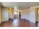 Bright living room with hardwood floors showing view into dining space at 3685 Jasmine St, Denver, CO 80207