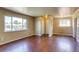 Inviting living room featuring gleaming hardwood floors and natural light at 3685 Jasmine St, Denver, CO 80207