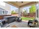 Cozy backyard patio with a hot tub, furniture and views of the neighborhood at 7018 E 123Rd Pl, Thornton, CO 80602