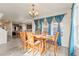 Comfortable dining room featuring natural lighting and hardwood flooring for Gathering dinners at 7018 E 123Rd Pl, Thornton, CO 80602