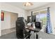Well-lit home office with a modern setup, perfect for productivity and comfortable work environment at 7018 E 123Rd Pl, Thornton, CO 80602
