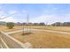 Picturesque community park with walking paths, green space, and charming homes in the background at 17614 Drake St, Broomfield, CO 80023