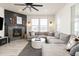 Comfortable living room with a fireplace, large sectional sofa, and modern decor at 17614 Drake St, Broomfield, CO 80023