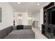 Bright living room with a plush gray sofa, showcasing an open floor plan at 17614 Drake St, Broomfield, CO 80023