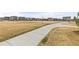 Expansive community park featuring a walking path and ample green space, perfect for outdoor activities and relaxation at 17614 Drake St, Broomfield, CO 80023