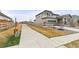 Charming two-story home with inviting curb appeal, a well-kept lawn, and a convenient attached two-car garage at 17614 Drake St, Broomfield, CO 80023