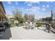 This expansive back deck is perfect for outdoor relaxation and entertaining with a table set, grill and dog bed at 9508 Lou Dr, Northglenn, CO 80260