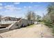 A tiered backyard offers a unique outdoor space with retaining wall, steps and a gravel area for various landscaping ideas at 9508 Lou Dr, Northglenn, CO 80260