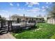 Backyard with wooden deck featuring patio seating, a storage shed, and green lawn, perfect for outdoor enjoyment at 9508 Lou Dr, Northglenn, CO 80260