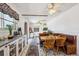 Cozy eat-in dining area with built-in bench seating and classic wood furniture, adjacent to a well-equipped kitchen at 9508 Lou Dr, Northglenn, CO 80260