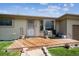 Charming front porch with wooden deck and seating area, creating a welcoming entrance to the home at 9508 Lou Dr, Northglenn, CO 80260