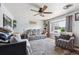 Bright and airy living room with large window, plush seating, and neutral decor, creating a relaxing space at 9508 Lou Dr, Northglenn, CO 80260