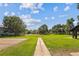 Open green space with a paved walkway, perfect for relaxing at 8471 Everett Way # A, Arvada, CO 80005