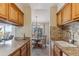 Well-maintained kitchen with granite countertops and wood cabinets at 8471 Everett Way # A, Arvada, CO 80005