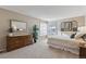 Bright and airy main bedroom with large windows and double vanity at 8471 Everett Way # A, Arvada, CO 80005