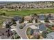Aerial view showcasing a well-planned neighborhood and a lush golf course at 22665 E Calhoun Pl, Aurora, CO 80016