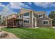 Well-maintained backyard with a large deck and pergola, perfect for outdoor entertaining at 22665 E Calhoun Pl, Aurora, CO 80016