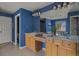 Bright bathroom features a double vanity with light wood cabinets and granite countertops at 22665 E Calhoun Pl, Aurora, CO 80016