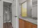 Bathroom features a modern walk-in shower with glass doors and a vanity with good storage at 22665 E Calhoun Pl, Aurora, CO 80016
