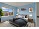 Bright bedroom with large windows and blue walls at 22665 E Calhoun Pl, Aurora, CO 80016