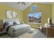 Bright bedroom featuring a vaulted ceiling, large window, and neutral color scheme at 22665 E Calhoun Pl, Aurora, CO 80016