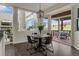 Eat-in kitchen area with backyard view, table, and access to the patio at 22665 E Calhoun Pl, Aurora, CO 80016