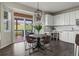 Bright kitchen dining nook with sliding glass doors to backyard at 22665 E Calhoun Pl, Aurora, CO 80016