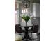 Cozy dining area features modern pendant lighting and views to the outside at 22665 E Calhoun Pl, Aurora, CO 80016