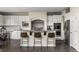 Modern kitchen features white cabinetry, granite countertops, and stainless steel appliances at 22665 E Calhoun Pl, Aurora, CO 80016