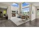 Bright and airy living room with high ceilings, fireplace, and expansive windows at 22665 E Calhoun Pl, Aurora, CO 80016